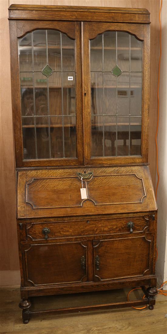 A 1920s oak bureau bookcase, W.91cm
